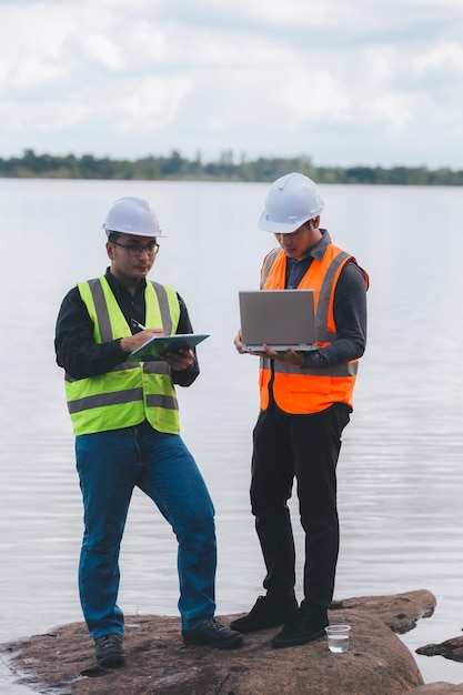 Environmental engineers work at wastewater treatment
plantswater supply engineering working at water recycling plant for
reusetechnicians and engineers discuss work together