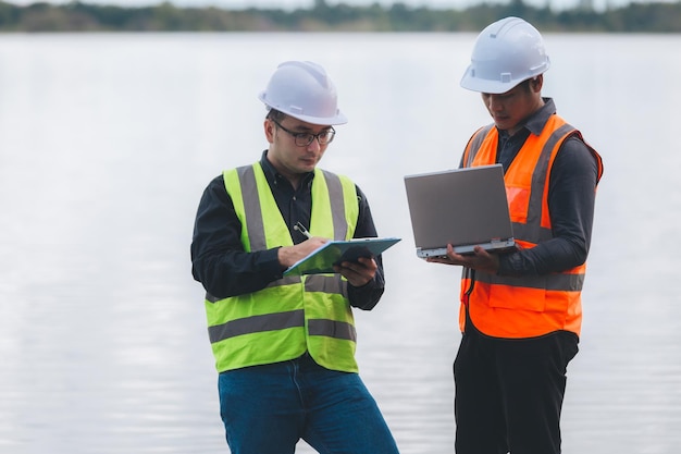 Environmental engineers work at wastewater treatment\
plantswater supply engineering working at water recycling plant for\
reusetechnicians and engineers discuss work together