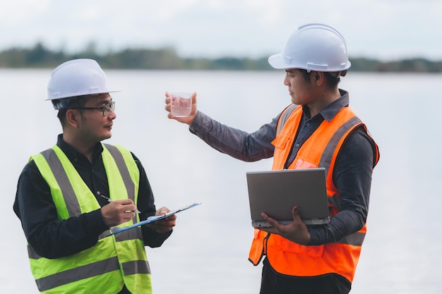 Environmental engineers work at wastewater treatment
plantswater supply engineering working at water recycling plant for
reusetechnicians and engineers discuss work together