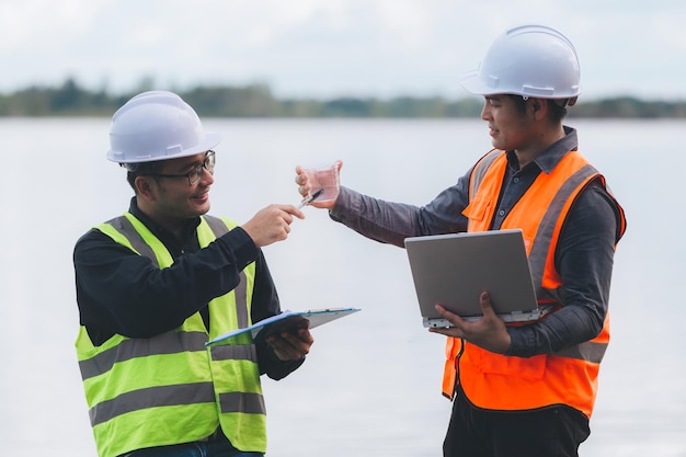 Environmental engineers work at wastewater treatment plantsWater supply engineering working at Water recycling plant for reuseTechnicians and engineers discuss work together