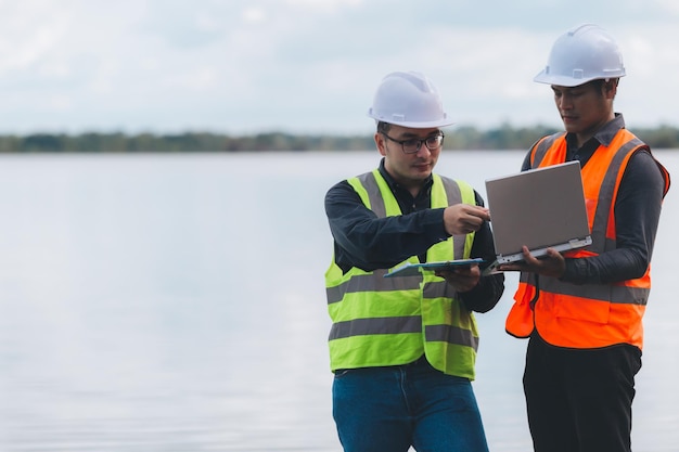 Environmental engineers work at wastewater treatment\
plantswater supply engineering working at water recycling plant for\
reusetechnicians and engineers discuss work together