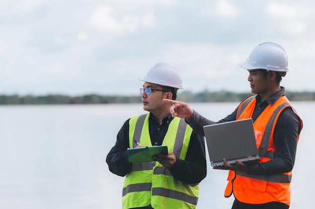 Environmental engineers work at wastewater treatment\
plantswater supply engineering working at water recycling plant for\
reusetechnicians and engineers discuss work together