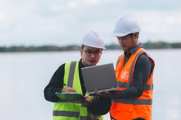 Environmental engineers work at wastewater treatment\
plantswater supply engineering working at water recycling plant for\
reusetechnicians and engineers discuss work together