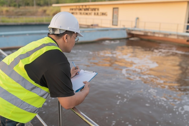 Environmental engineers work at wastewater treatment plantswater supply engineering working at water