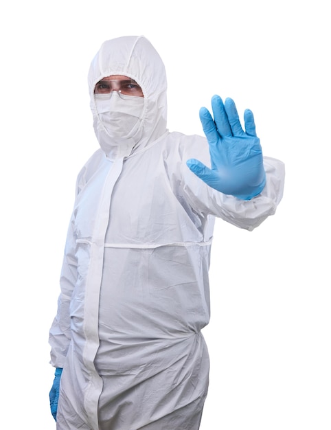 epidemiologist in antiepidemic  isolation suit shows a prohibitory gesture