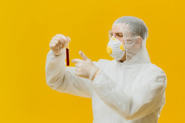 Epidemiologist holding and pointing to Sample