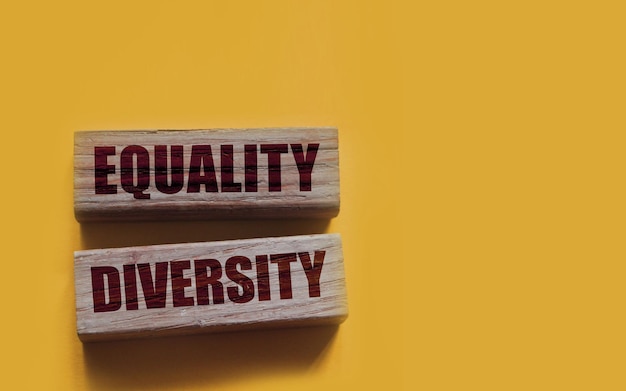 Photo equality diversity words written on wood blocks etolerance inclusion social and business concept