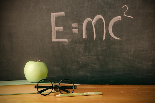 Photo equation emc2 handwritten on blackboard