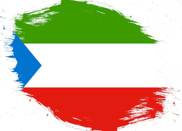 Equatorial guinea flag on distressed grunge brush background