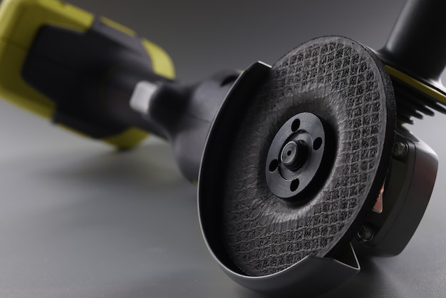 Equipment angle grinder on a gray background