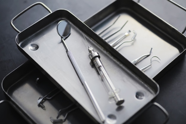 Equipment for the dental office. orthopedic instruments. dental technician with working tools. dentist metal tools