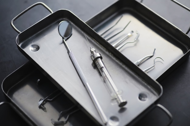 Equipment for the dental office. Orthopedic Instruments. Dental technician with working tools. Dentist metal tools.