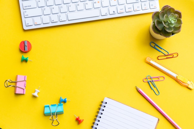 Equipment and empty notebook with on yellow