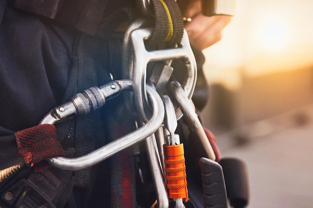 Equipment of industrial mountaineer laborer on roof of building during industry highrise work Worker equipments before starting job