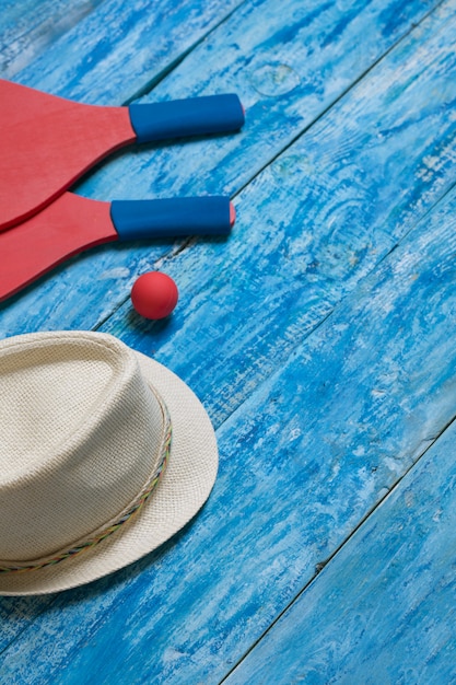 Equipment for playing beach tennis on the blue wooden table