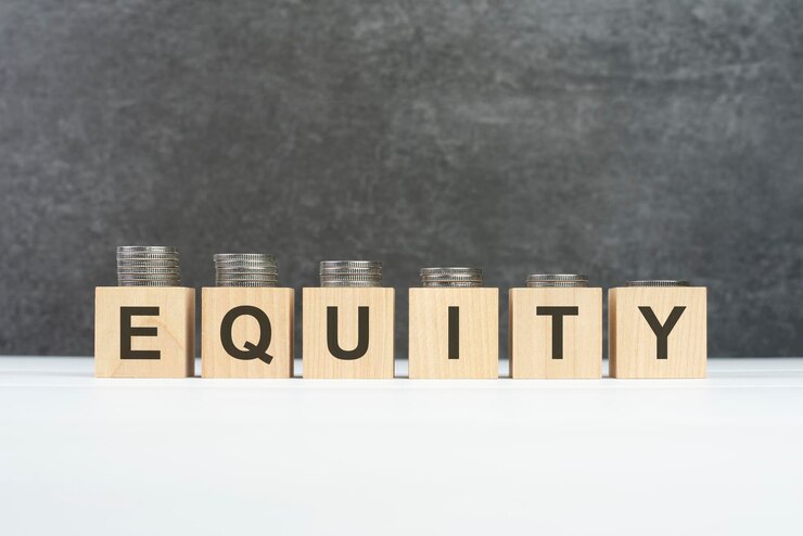 Equity text written on wooden block with stack of coins on black background