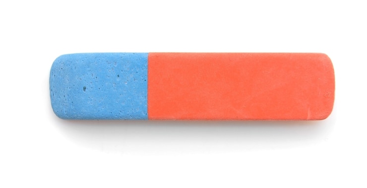 Photo eraser on a white table .