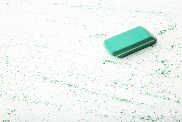 Photo eraser with particles on white background