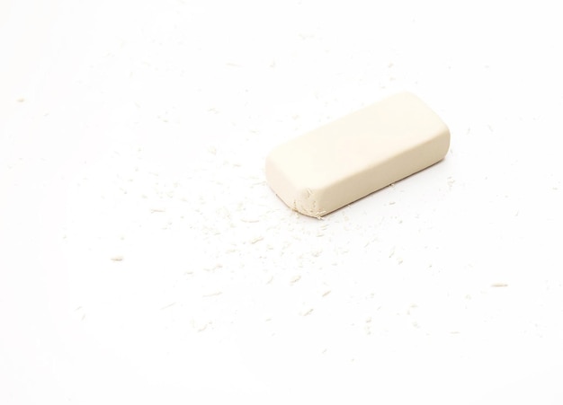 Eraser with particles on white background