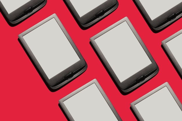 ereader tablets screens on red background