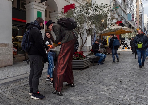 Ermou Street is central shopping street of city of Athens with typical Greek architecture in Greece