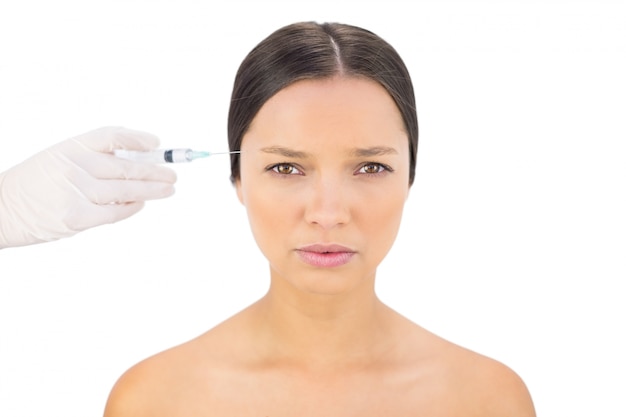 Ernstig kaal model met botox injectie