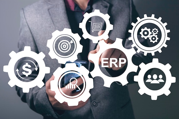 ERP and gear icons Enterprise resource planning concept Man tapping on the screen