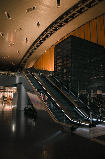 Escalator with gate sign in airport