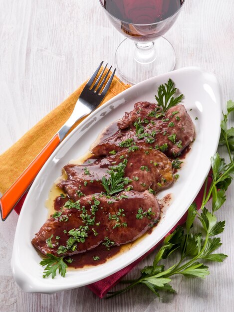 Photo escalope cooked with red wine