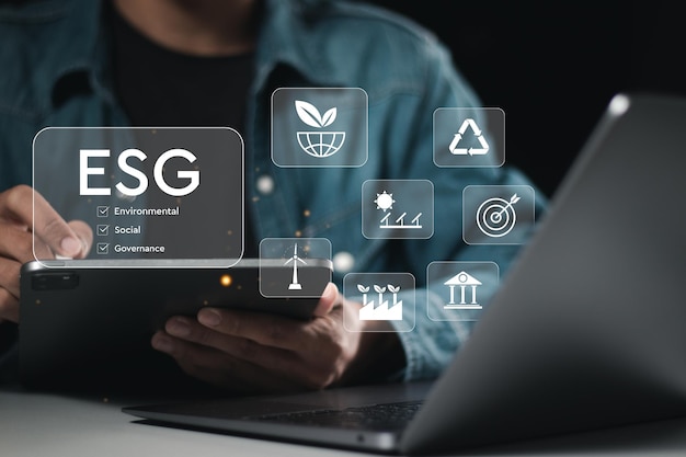 ESG concept businessman use tablet analyze ESG environment social governance investment business for sustainable and ethical business on network connection