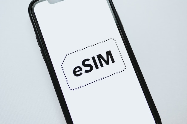 Photo esim card chip logo on the smartphone screen.