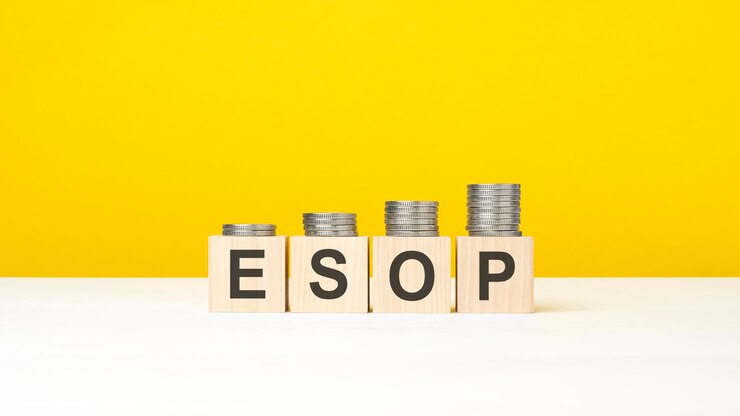 Esop word on wooden cubes yellow background growing trend