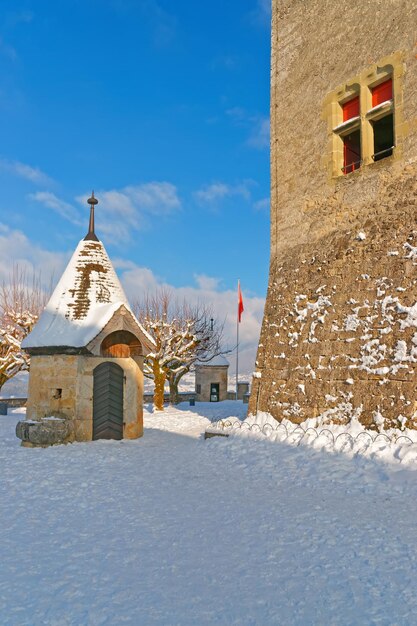 Esplanade in front of the Gruyere castle in Switzerland on a sunny winter day