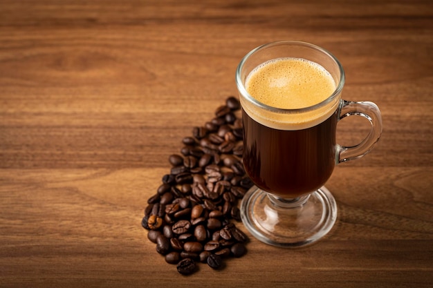 Espresso and coffee beans on the table