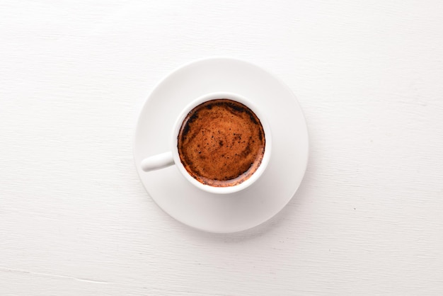 Espresso coffee cup on a white wooden background Top view Free space for text