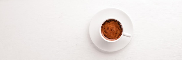 Espresso coffee cup on a white wooden background Top view Free space for text