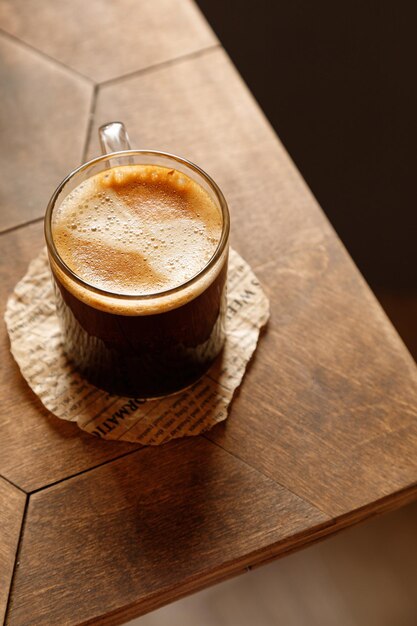 Espresso coffee with cakes on a wooden table