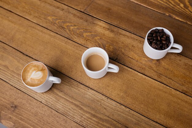 Espresso coffee on a wooden table Coffee in a small cup Good morning Small cups of coffee Grain