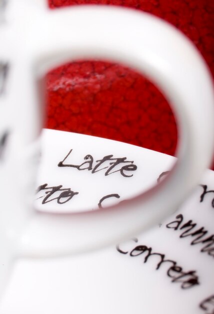 Photo espresso cup closeup on red background