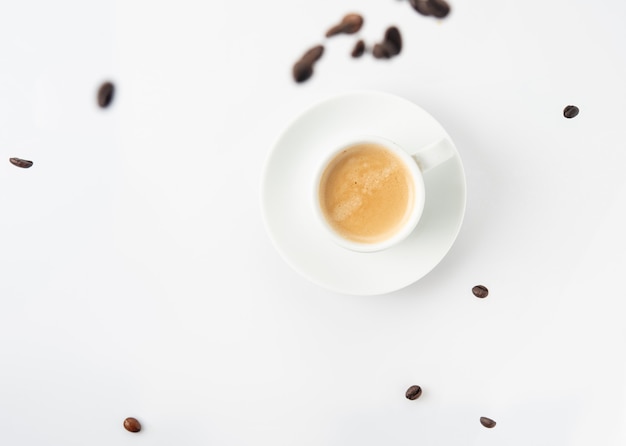 Espresso cup with coffee beans