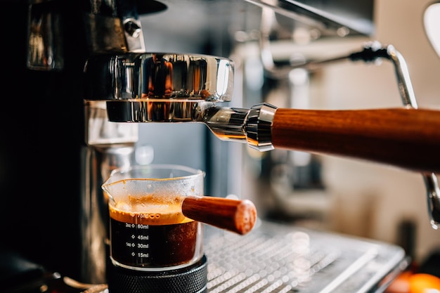 espresso machine pouring espresso shot in the glass cover banner background concept