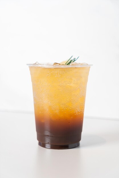 espresso soda with rosemary on top in glass