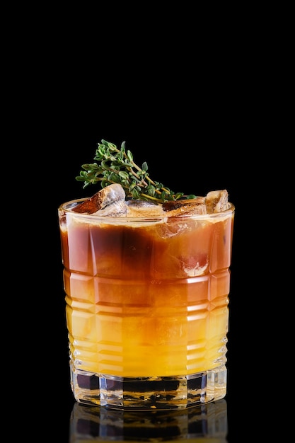 Espresso and tonic with orange syrup and thyme