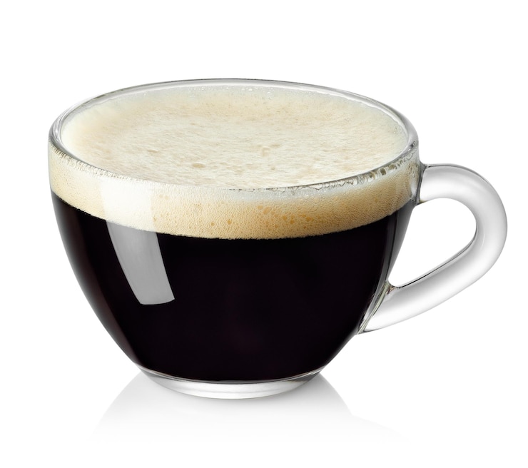 Photo espresso in transparent glass cup isolated on white