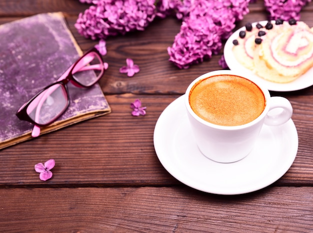 Espresso in a white round cup with saucer 