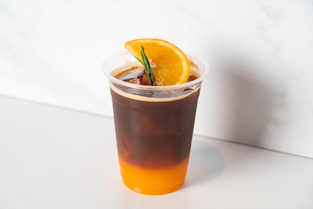 Espresso with orange juice in glass