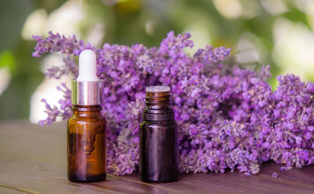 Essential oil of lavender on a wooden background