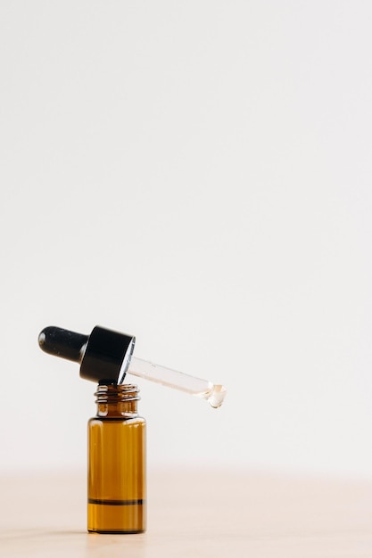 Essential oil in one bottle standing on the surface