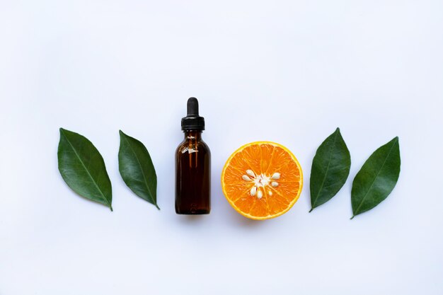 Essential oil with orange and green leaves