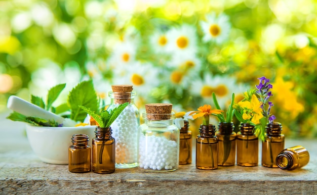 Essential oils and herbal extracts in small bottles. Selective focus. nature.